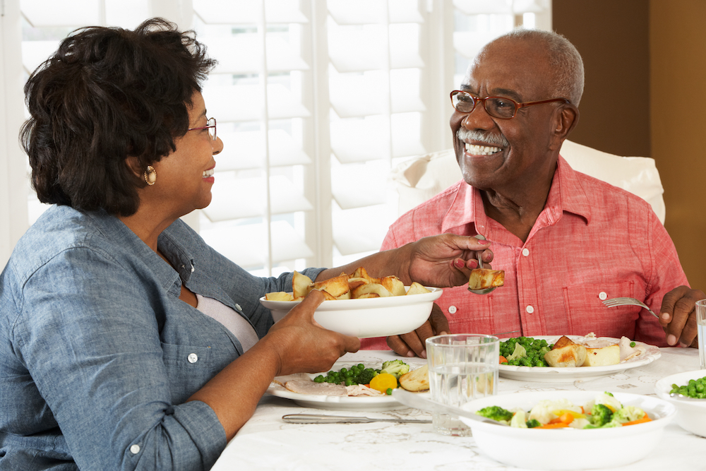 A senior couple shares a healthy meal together