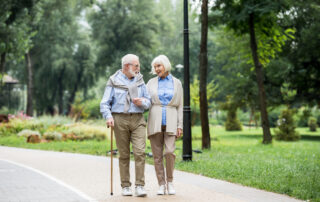 A nicely dressed senior couple on a walk