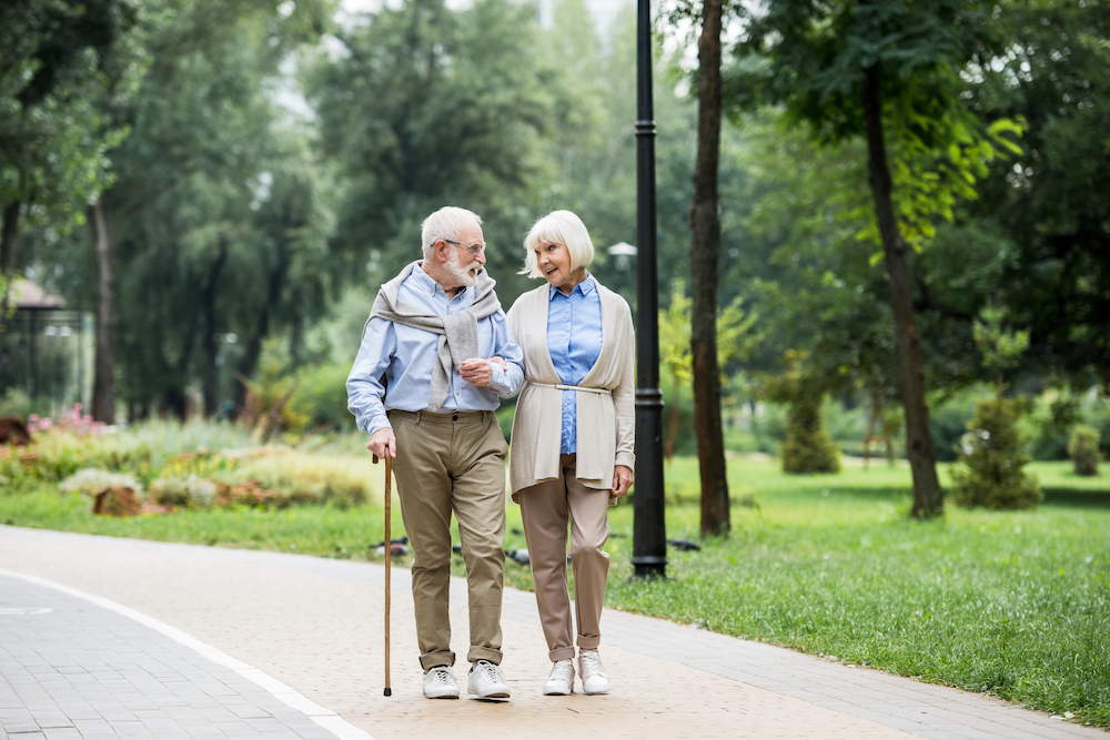 A nicely dressed senior couple on a walk