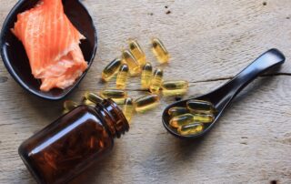 Fish oil capsules and bottle