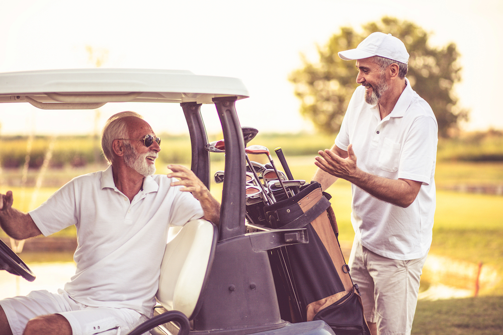 Two senior men out playing golf