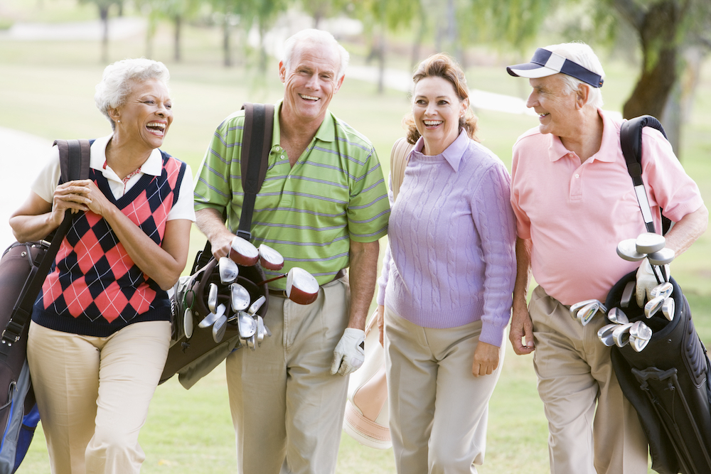 Four senior independent living friends go golfing together