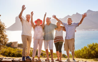 Group of Senior Friends in front of ocean enjoying independent living oceanside ca