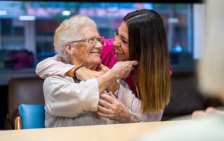 Senior woman with caregiver after finding the best memory care facilities near me